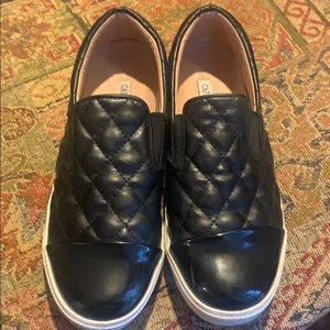 Black quilted slip on tennis shoes